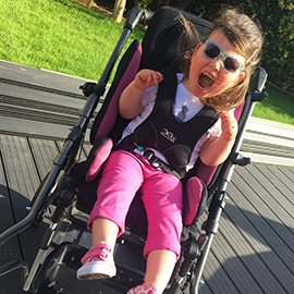 Ella in her special needs Snappi Buggy